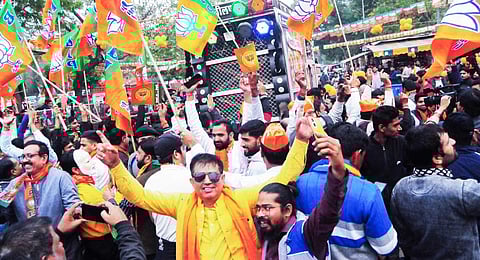 Bharatiya Janata Party (BJP) workers celebrate as the party leads in the Rajasthan Assembly elections.(Photo