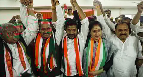 Congress leaders celebrate after the victory of the party in Telangana Assembly elections.(