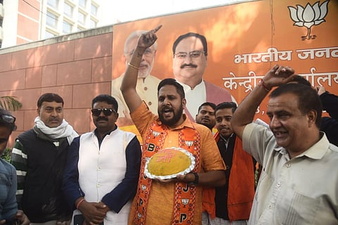 BJP supporters outside the party Headquarters in New Delhi on December 3. (Photo | Parveen Negi)