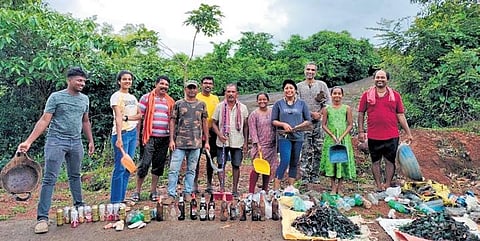 Jeeth along with volunteers and schoolchildren, cleaning up forest spaces and planting saplings during a forest cleaning project | Express