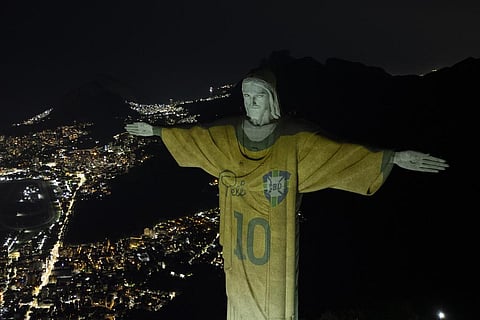 The Christ the Redeemer statue is illuminated with an image of Pele's Brazilian jersey, as a tribute to the soccer legend on his one-year death anniversary, in Rio de Janeiro, Brazil | AP