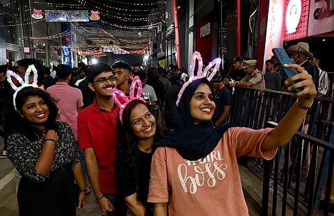 Revellers take selfie on Brigade Road to usher in the New Year in Bengaluru. (Photo | Shashidhar Byrappa, EPS)