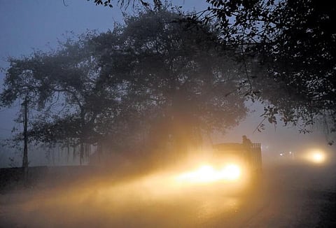 A mini-truck is seen driving through a foggy stretch of National Highway 163 on the outskirts of Hyderabad on Friday | Sri Loganathan Velmurugan