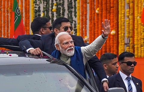 Prime Minister Narendra Modi waves to the crowd during a roadshow, in Ayodhya, Saturday, Dec. 30, 2023 | PTI
