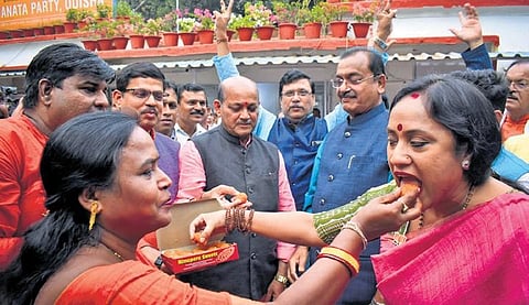 State BJP president Manmohan Samal along with other leaders celebrate the victory in Rajasthan, MP and Chhattisgarh, at the party headquarters in Bhubaneswar