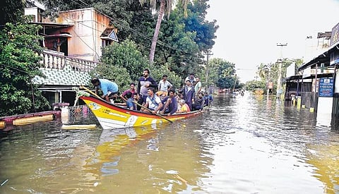 TNFRS personnel rescuing people from waterlogged Mudichur near Tambaram in Chennai on Tuesday. (Photo | P Ravikumar, EPS)