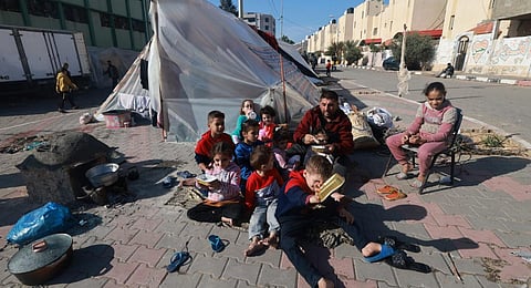 A displaced Palestinian family who fled Khan Younis sets up camp in Rafah further south near the Gaza Strip's border with Egypt, on December 6, 2023. (Photo | AFP)