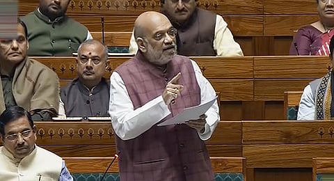 Home Minister Amit Shah speaks in the Lok Sabha during the Winter session of Parliament, in New Delhi, Wednesday, Dec. 6, 2023. (Photo | PTI)