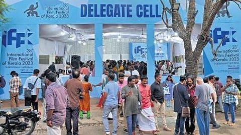 Film enthusiasts throng the delegate cell at IFFK for their entry passes on Wednesday