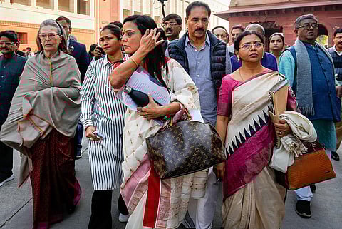 TMC MP Mahua Moitra with Congress MP Sonia Gandhi and other opposition leaders outside the Lok Sabha (Photo | PTI)