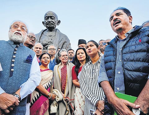 TMC leader Mahua Moitra with party MP Sudip Bandyopadhyay, Congress MP Sonia Gandhi and other opposition leaders in Parliament House in New Delhi on Friday | pti
