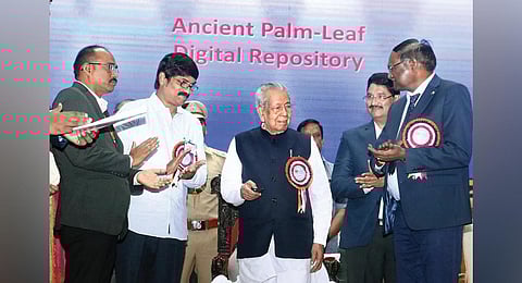 Governor Biswa Bhusan Harichandan uploads the digitised ancient palm leaf manuscripts to the Cloud at Andhra University on Tuesday I G Satyanarayana