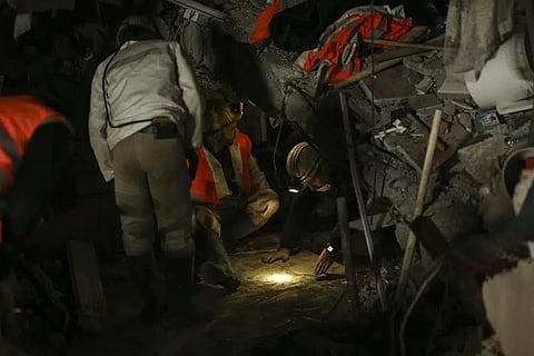 Rescue workers try to reach survivors on a collapsed building in Adiyaman, southern Turkey, Thursday, Feb. 9, 2023. (Photo | AP)