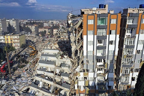 Cranes remove debris next to destroyed buildings in Antakya, southeastern Turkey, Friday, Feb. 10, 2023. (Photo | AP)