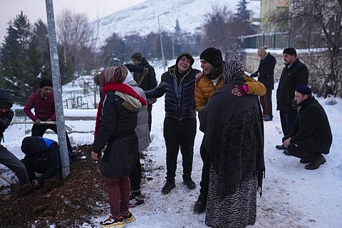 Relatives and friends of Syrian refugee Naziha Al-Ahmad bury her in a cemetery after she died during an earthquake, in Elbistan, southeastern, Turkey (Photo | AP)