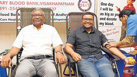KRB Prakash and his son K Rohit donating blood at a camp in Vizag | EXPRESS