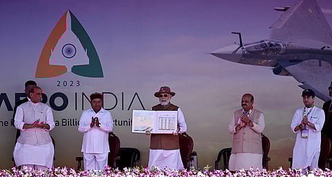 Prime Minister Narendra Modi releases commemorative stamps during the inaugural ceremony of Aero India 2023, in Bengaluru. (Photo | Shashidhar Byrappa, EPS)