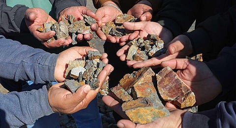 Reasi: Villagers show lithium stones in Reasi district, Sunday, Feb. 12, 2023. (Photo | PTI)