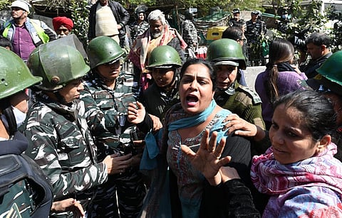 Mehrauli: Women resist demolition of their houses. (Photo | EPS)