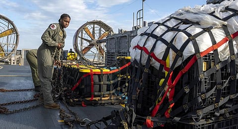 Sailors assigned to Assault Craft Unit 4 prepare material recovered off the coast of Myrtle Beach, S.C., in the Atlantic Ocean from the shooting down of a Chinese high-altitude balloon. (Photo | AP)