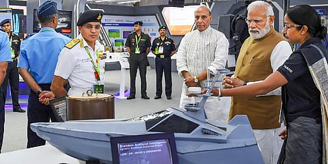 Prime Minister Narendra Modi with Defence Minister Rajnath Singh at the 14th edition of Aero India 2023, in Bengaluru on Feb. 13, 2023.