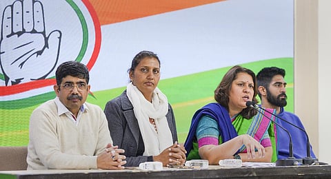 Krishna Poonia (second from left) with Supriya Shrinate and Vijender Singh addresses a media briefing, at AICC Headquarters in New Delhi on Jan. 20, 2023. (Photo | PTI)