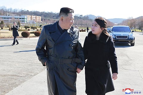 North Korean leader Kim Jong Un, (L), and his daughter Kim Ju Ae walk to a photo session in Pyongyang, Nov. 27, 2022 (Photo | AP)