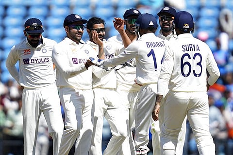 Indian players celebrate the wicket of Australia's Marnus Labuschagne during the first day of the first cricket test match in Nagpur, Feb. 9, 2023. (Photo | AP)