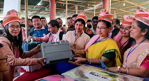 Women poll officials collect EVMs and other election material for the Tripura Assembly elections on Wednesday, Feb. 15, 2023. (PTI)