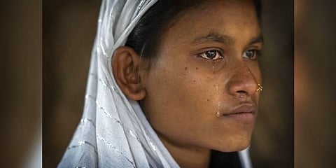 Nureja Khatun, 19, cries as she waits in her shanty home for her husband Akbor Ali to return, in Morigaon district of Indian northeastern state of Assam, Saturday, Feb. 11, 2023. (Photo | AP)