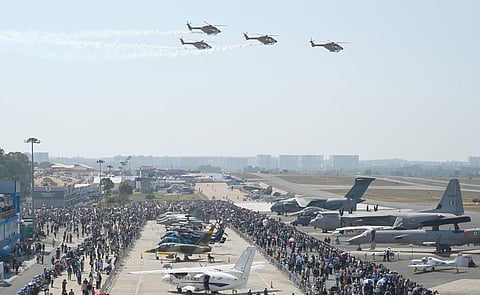 Visitors take a look at the aircraft on display at the 14th edition of Aero India. (Photo | Nagaraja Gadekal, EPS)