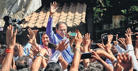 Uddhav Thackeray waves at supporters, a day after the EC recognised Shinde faction as the real Shiv Sena at Bandra in Mumbai on Saturday | PTI
