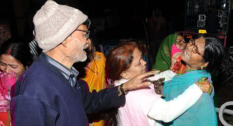 Family members of the victims mourn after a major fire broke out in a multi-storey building in Dhanbad. (Photo | PTI)