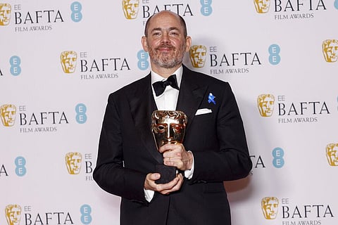 Edward Berger poses for photographers with the Director Award for the film 'All Quiet on the Western Front' at the 76th British Academy Film Awards, BAFTA's, in London (Photo | AP)