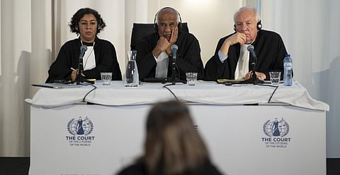 Judges Priya Pillai, left, Zak Yacoob, center, and Stephen Rapp, right, listen to the first witness of the 'people's tribunal' where prosecutors symbolically put Putin on trial.(Photo | AP)