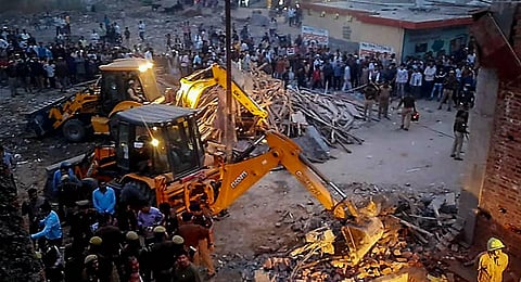 escue operation underway after lenter of under-construction building fell, at Loni in Ghaziabad. (Photo | PTI)