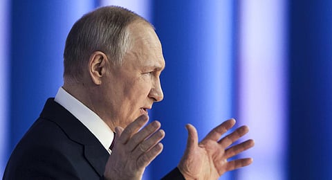 Russian President Vladimir Putin gestures as he gives his annual state of the nation address in Moscow, Russia. (Photo | AP)
