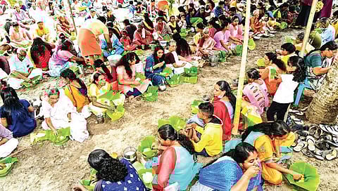 Devotees participating in the special meal ‘kuthiramootil kanji’ in Erezha south village at Chettikulangara | Express
