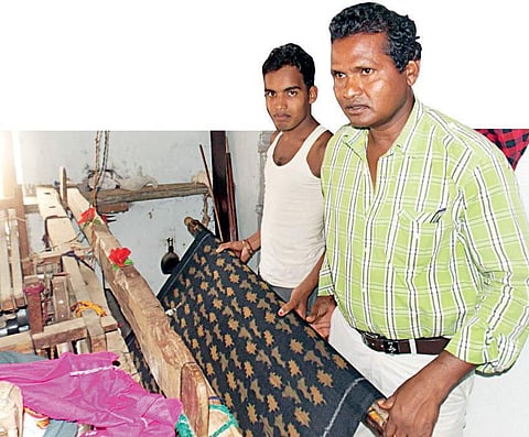 Image used for representational purpose. Rajendra Sikandar (in green shirt) along with a weaver in Bargarh | Express