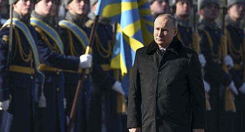 Russian President Vladimir Putin, foreground, attends a wreath-laying ceremony at the Tomb of the Unknown Soldier, near the Kremlin Wall.(Photo | AP)