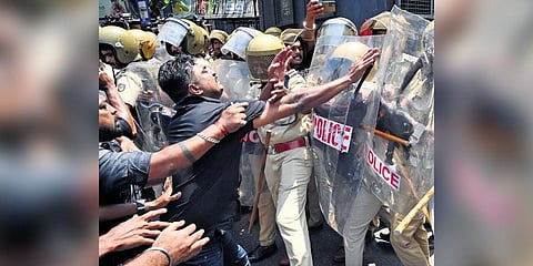 The ‘black march’ protest turns violent after Youth Congress activists push the barricades which saw the police resorting to charging three rounds of water cannons against them | Vincent Pulickal