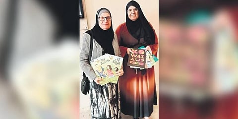 Dr Maysoon Salama and Aliya Danzeisen with the story books