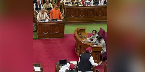 Uttar Pradesh Chief Minister Yogi Adityanath and Samajwadi Party President & MLA Akhilesh Yadav during the Budget Session of UP Assembly, at Vidhan Bhawan in Lucknow, Saturday. (Photo | PTI)