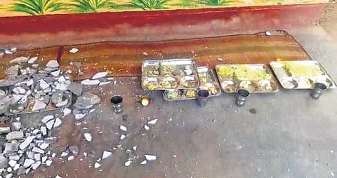 Pieces of cement plaster which fell on the children at the anganwadi centre | Express
