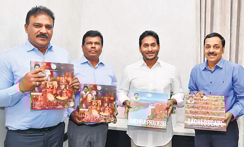 Chief Minister YS Jagan Mohan Reddy releasing multilingual coffee table books at the camp office