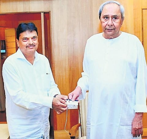 Finance Minister Niranjan Pujari presenting a digital copy of budget to CM Naveen Patnaik at the Assembly in Bhubaneswar | EXPRESS