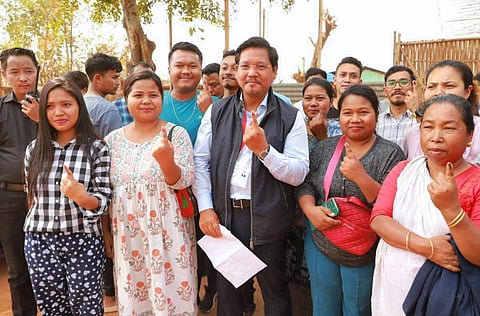 Meghalaya Chief Minister Conrad K. Sangma and his family members show their fingers marked with indelible ink after casting their votes at a polling booth during Meghalaya Assembly elections | PTI