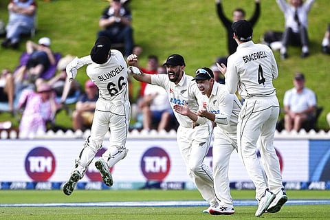 New Zealand's Tom Blundell (L) celebrates with teammates after catching out England's Ben Duckett on day 5 of their cricket test match in Wellington, Feb 28, 2023. (Photo | AP)