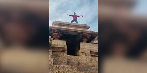 A still from the viral video of a tourist dancing atop a heritage monument on Hemakuta hills in Hampi