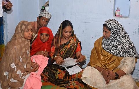 NCM member Shahezadi Syed (right) takes details of Qadeer’s death from his wife and children in Medak on Monday